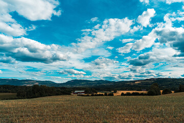 Fototapeta na wymiar View towards the Totenåsen Hills from the lowlands in summer.