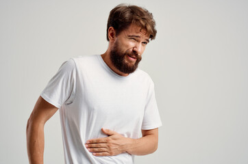 man holding his stomach pain dissatisfaction health problems discomfort