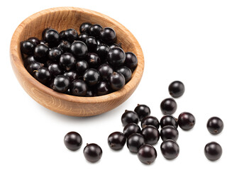 black currant in wooden bowl isolated on white background. macro. clipping path
