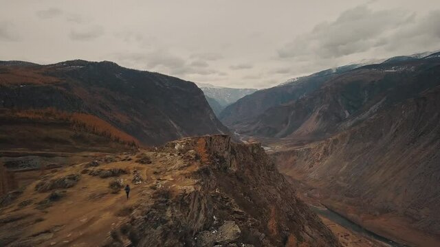 Katu Yaryk mountain pass in the valley of the Chulyshman River, Altai, Siberia, Russia. A huge stone gorge, a canyon, a mountain winding river, a dangerous serpentine highway. Freedom, loneliness