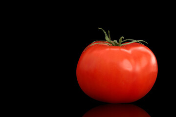 red tomato isolated on black