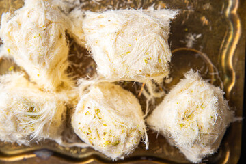 pismaniye cotton candy turkish sweet nut and pistachio dessert sweet meal snack on the table copy space food background rustic. top view