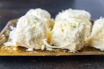 pismaniye cotton candy turkish sweet nut and pistachio dessert sweet meal snack on the table copy space food background rustic. top view
