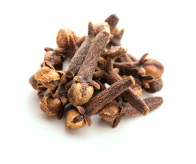 Dry cloves on white background. Pile of spice cloves macro close-up.