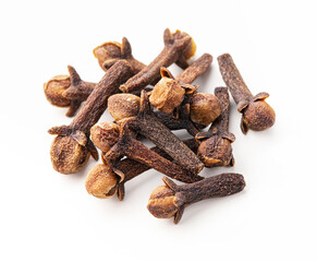 Dry cloves on white background. Pile of spice cloves macro close-up.
