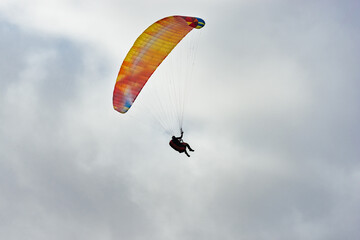 Paraglider Flying in the Sky - 467005114