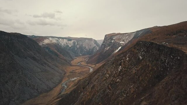 Katu Yaryk mountain pass in the valley of the Chulyshman River, Altai, Siberia, Russia. A huge stone gorge, a canyon, a mountain winding river, a dangerous serpentine highway. Freedom, loneliness
