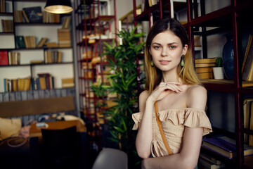 beautiful woman reading a book in a cafe communication