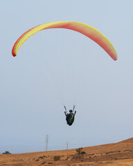 Paraglider Pilot Flying in the Sky - 467008779