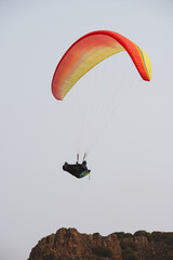 Paraglider Pilot Flying in the Sky - 467008783