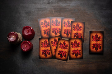 Tarot cards on the old dark wooden table.