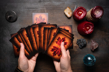 Fortune teller reads the future by her tarot cards.