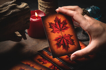 Fortune teller reads the future by her tarot cards.