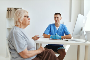 the patient sits in the doctor's office health care