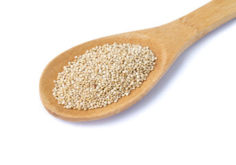 Raw quinoa grains in a spoon isolated over white background