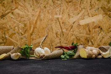 ingredients spices hot pepper ginger garlic greens on beige background 