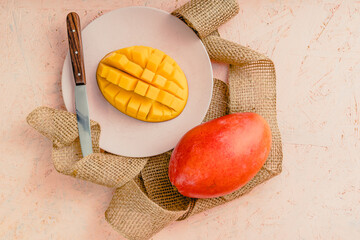 exotic fruits mango lime on peach background pink background delicate colors