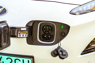 open charger of electric car with green licence plate