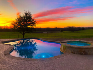 Sunset in the background of beautiful pool