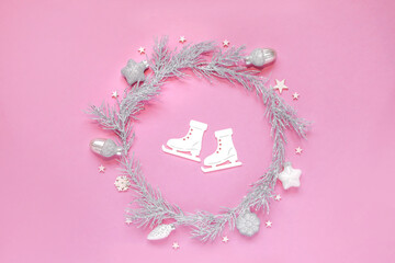Christmas wreath of silver and white Christmas balls sprinkled with snow in the form of a circle. Christmas circle composition. Winter holiday design, flat lay, top view. with white skates inside