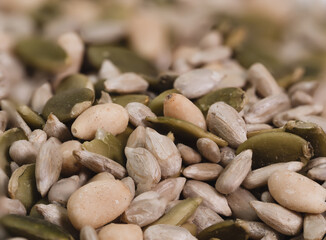 sunflower seeds mixed with other seeds, healthy diet, vegetarian concept, macro photo many details