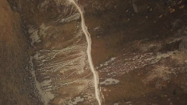 Katu Yaryk mountain pass in the valley of the Chulyshman River, Altai, Siberia, Russia. A huge stone gorge, a canyon, a mountain winding river, a dangerous serpentine highway. Freedom, loneliness