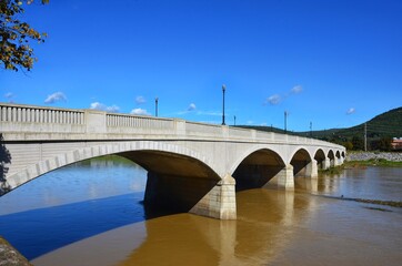 CENTERWAY ARCH BRIDGE, in Corning, New York. Centerway Walking Bridge Earns National Recognition. Built in 1921, the 40-foot-wide, 710-foot-long; while the restoration completed in 2013. chemung river