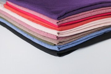 Pile of colorful cotton fabric on white background