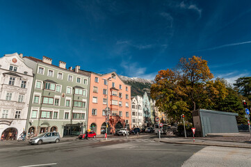 Innsbruck, Tyrol, Austria. Colorful houses and river inn on a sunny day with blue sky on october 18, 2021.
