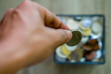 Save coins in a glass box.