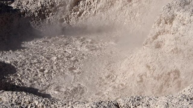 A hot spring of mud at The Artist's Paintpots in Yellowstone National Park . Camera fixed. With Sound