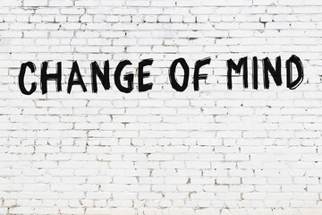 Inscription change of mind painted on white brick wall