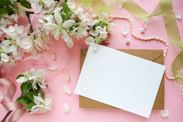 postcard mockup. Frame from flowering spring branches and white blank for the text. congratulation....