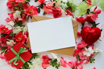 postcard mockup. Frame from flowering spring branches and white blank for the text. congratulation. invitation