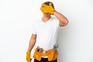 Young electrician blonde man isolated on white background covering eyes by hands. Do not want to see something