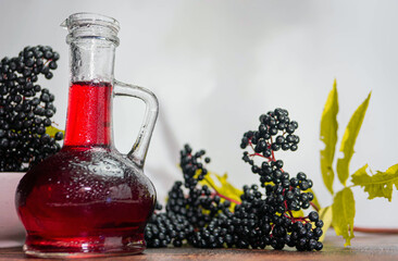 Healing red balm made from ripe berries, elderberries with red syrup. Homeopathy copy space