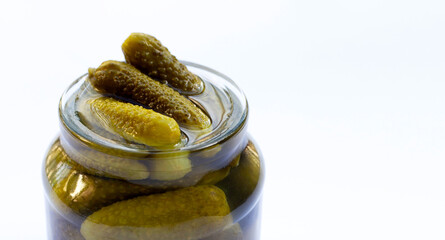 Pickled gherkins or cucumbers in a jar