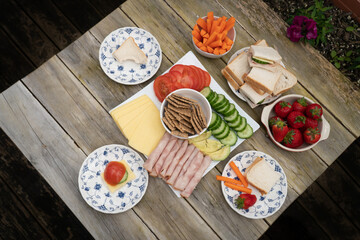 Fototapeta na wymiar Healthy Lunch On Patio Table Set out for Children Outdoors
