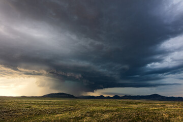 Naklejka na ściany i meble Stormy sky with dramatic clouds in Montana
