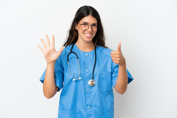Young surgeon doctor caucasian woman isolated on white background counting six with fingers