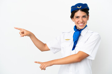 Airplane stewardess caucasian woman isolated on white background pointing finger to the side and...