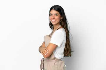 Fototapeta premium Restaurant waiter over isolated white background with arms crossed and looking forward