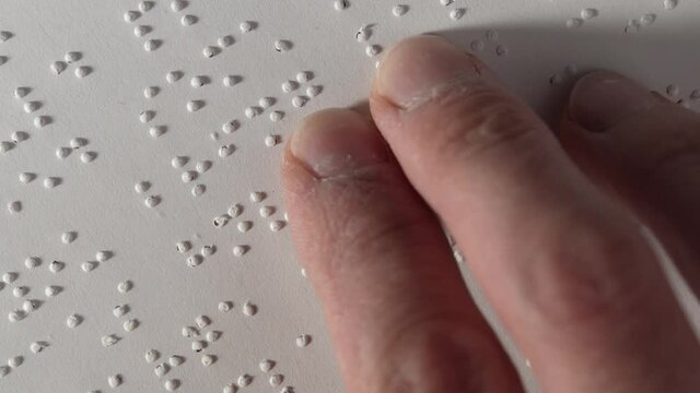 Braille Text Reading With Fingers of a Blind Person Closeup