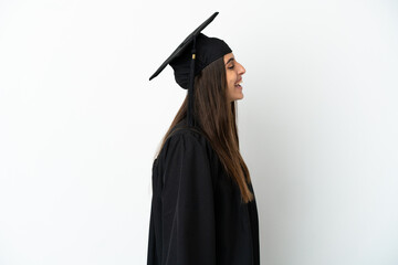 Young university graduate isolated on white background laughing in lateral position