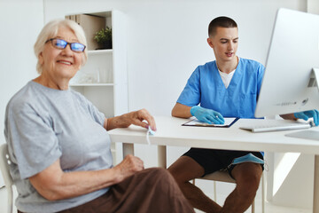 elderly woman sitting in the doctor's office health care