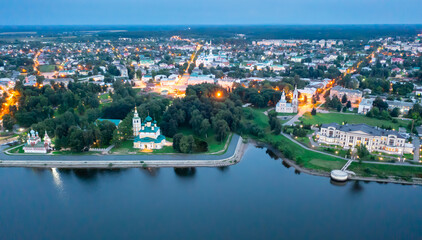 Fototapeta premium Flight over evening city of Uglich and Epiphany Cathedral on the banks of Volga River