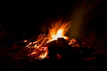 slow speed of burning wood fire in the dark
