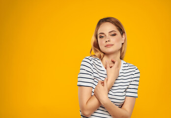 woman in striped t-shirt studio emotion posing model