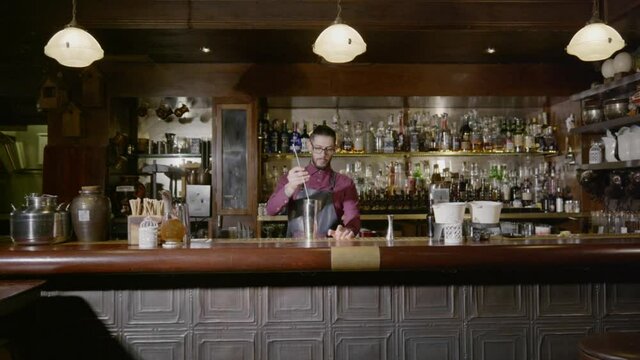 A bartender spinning his spoon