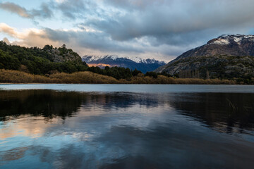 Fototapeta na wymiar Mountains at sunset reflected in the lake